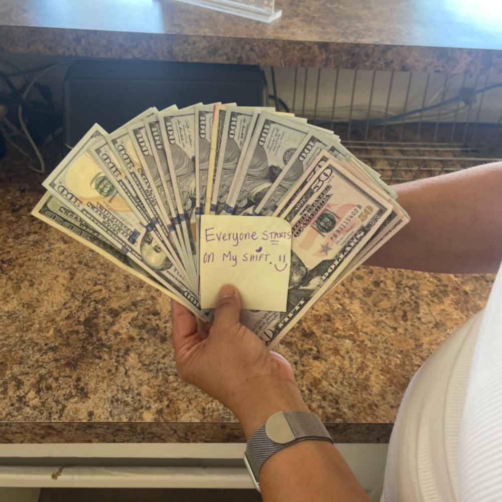 Everyone starts on my shift... holding up the day's collections at the front desk