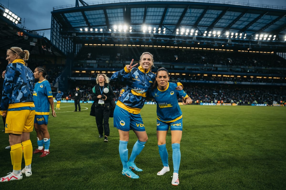 Carly Telford and Claire Rafferty celebrate on the pitch after the Game4Ukraine charity match at Stamford Bridge, London, 5 August 2023.