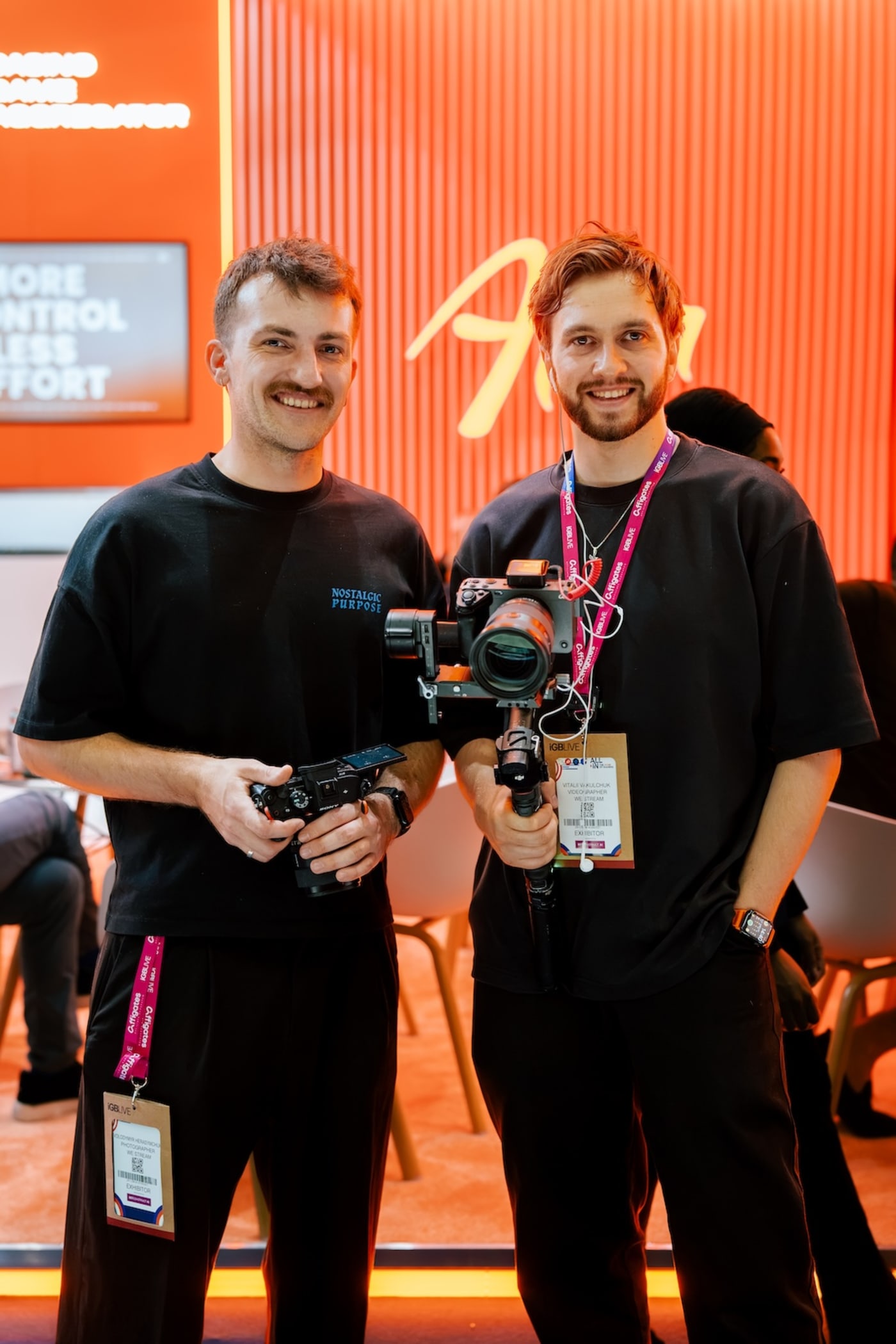 Vitalii Vakulchuk and a We Stream camera operator with camera rigs at the Alea stand at IGB Live