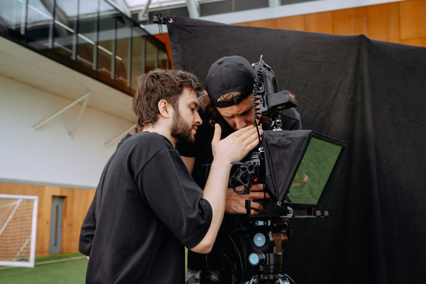 Two We Stream camera operators checking the shot on a cinema camera during the Blue Lock shoot