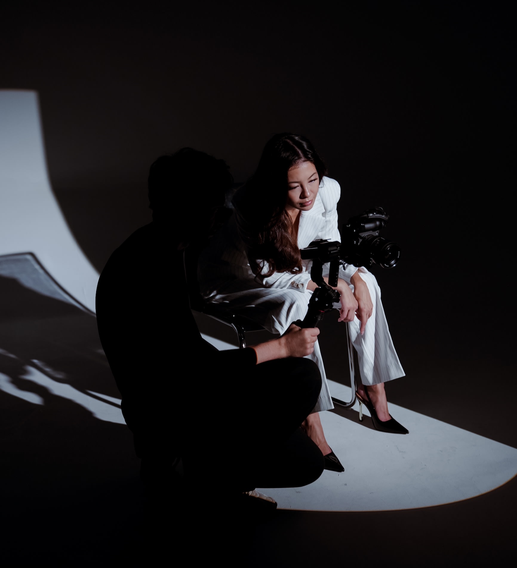 A We Stream operator filming a model on a studio set