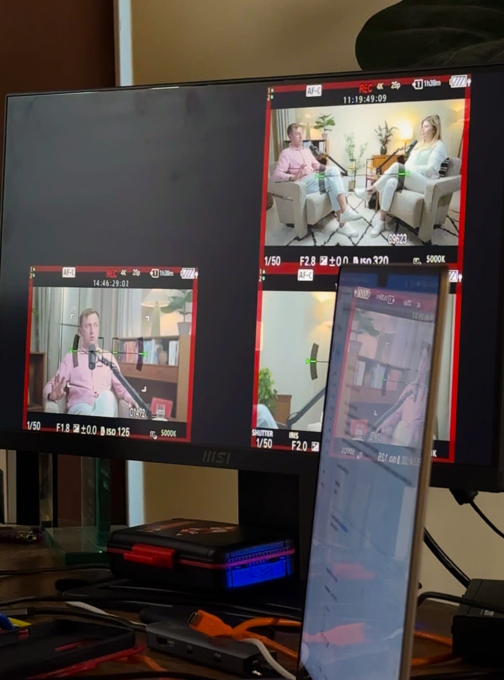 Monitor showing the podcast camera angles while recording, checked by a We Stream producer