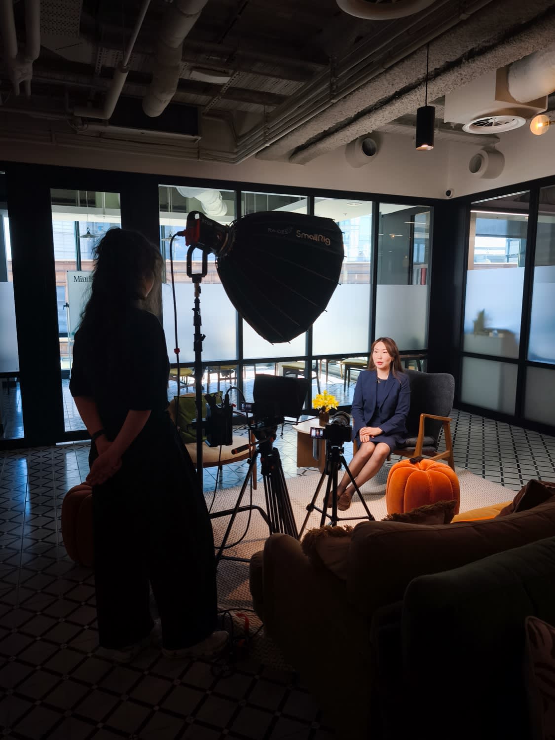 Softbox lighting and two cameras set up by We Stream in a co-working lounge