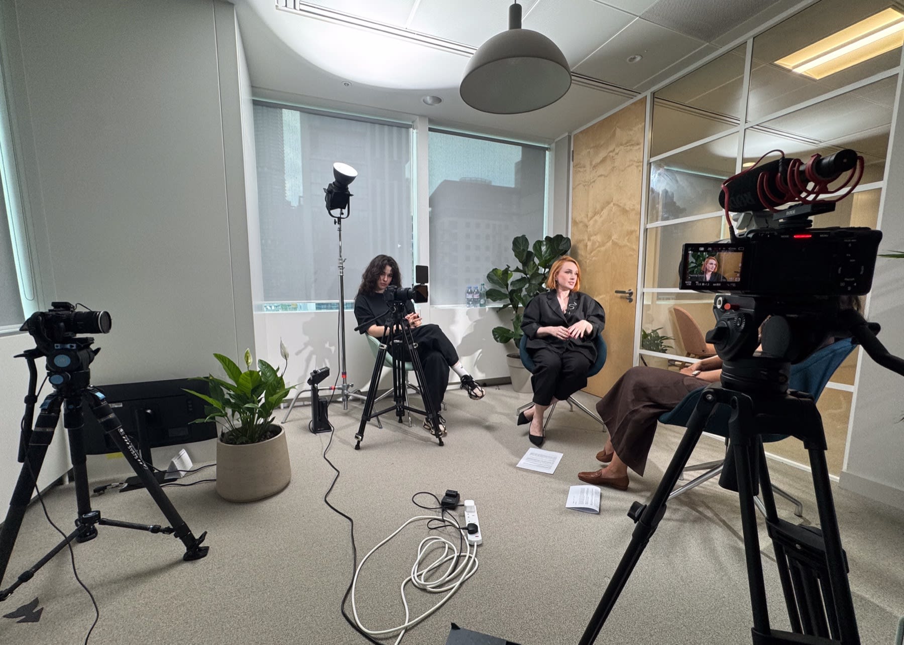 Interview podcast filmed in an office meeting room with three cameras and a key light