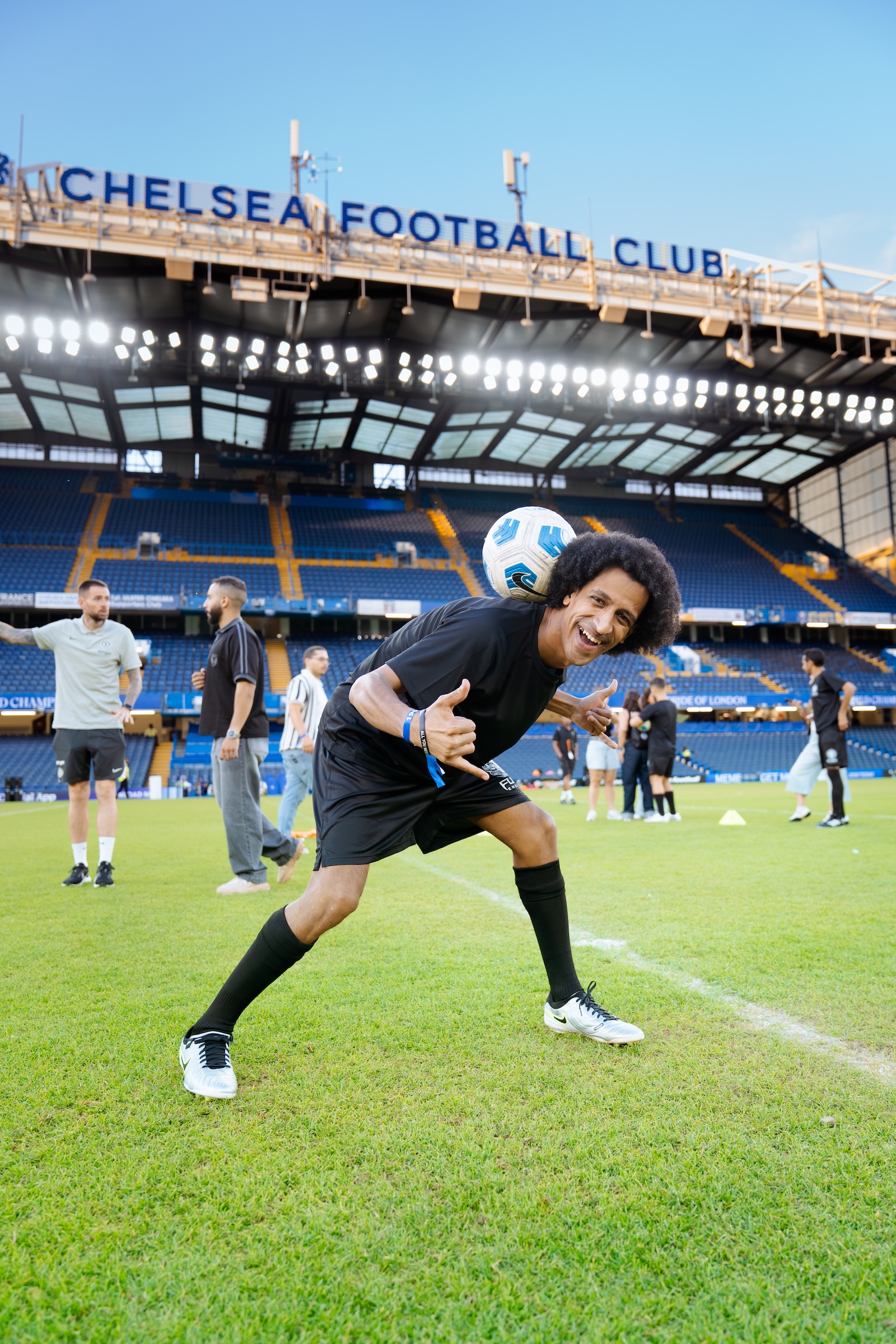 Gamey Freestyle performing football freestyle tricks on the pitch at Stamford Bridge, Chelsea FC