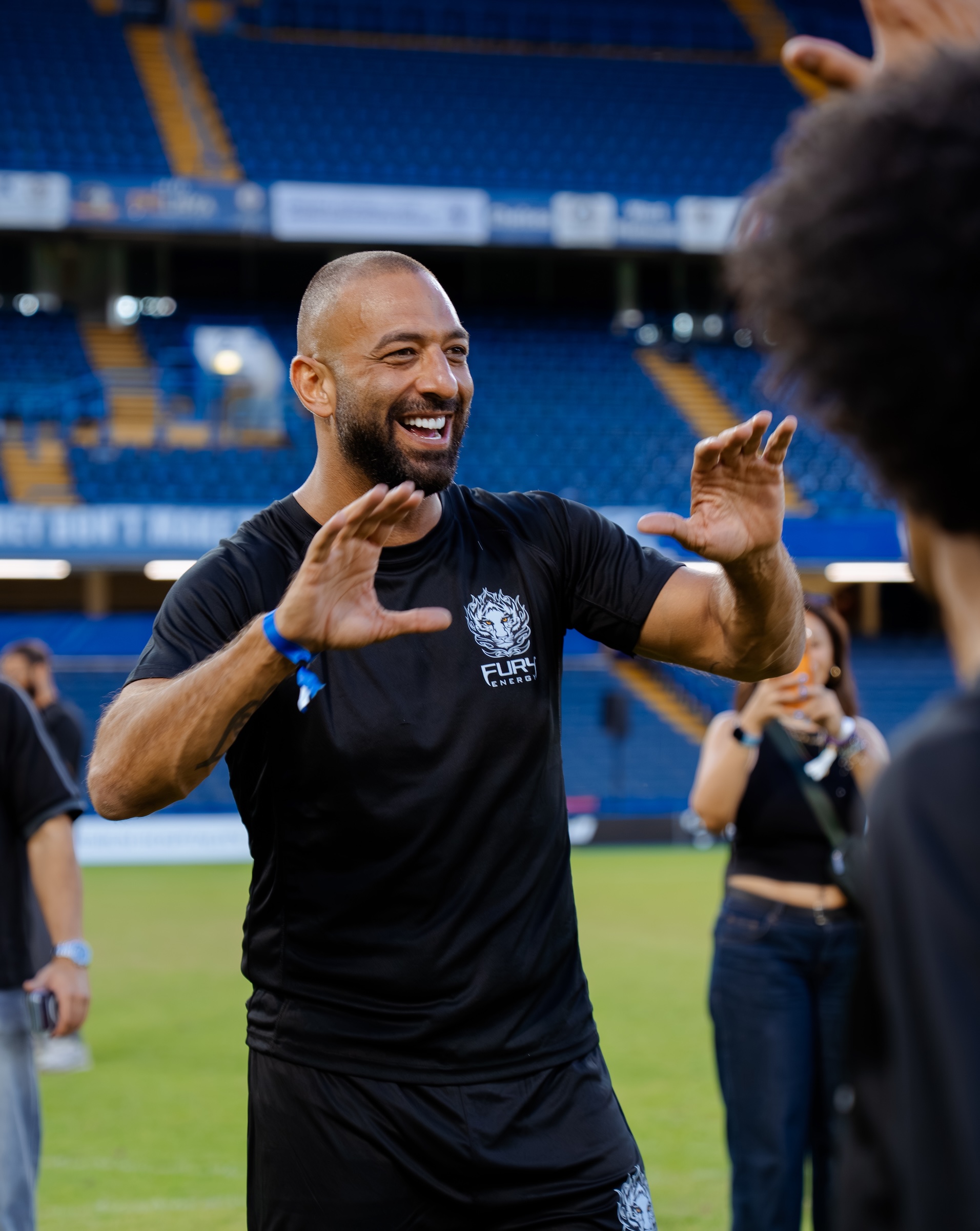 Mido applauding pitchside during the Fury Energy shoot at Stamford Bridge