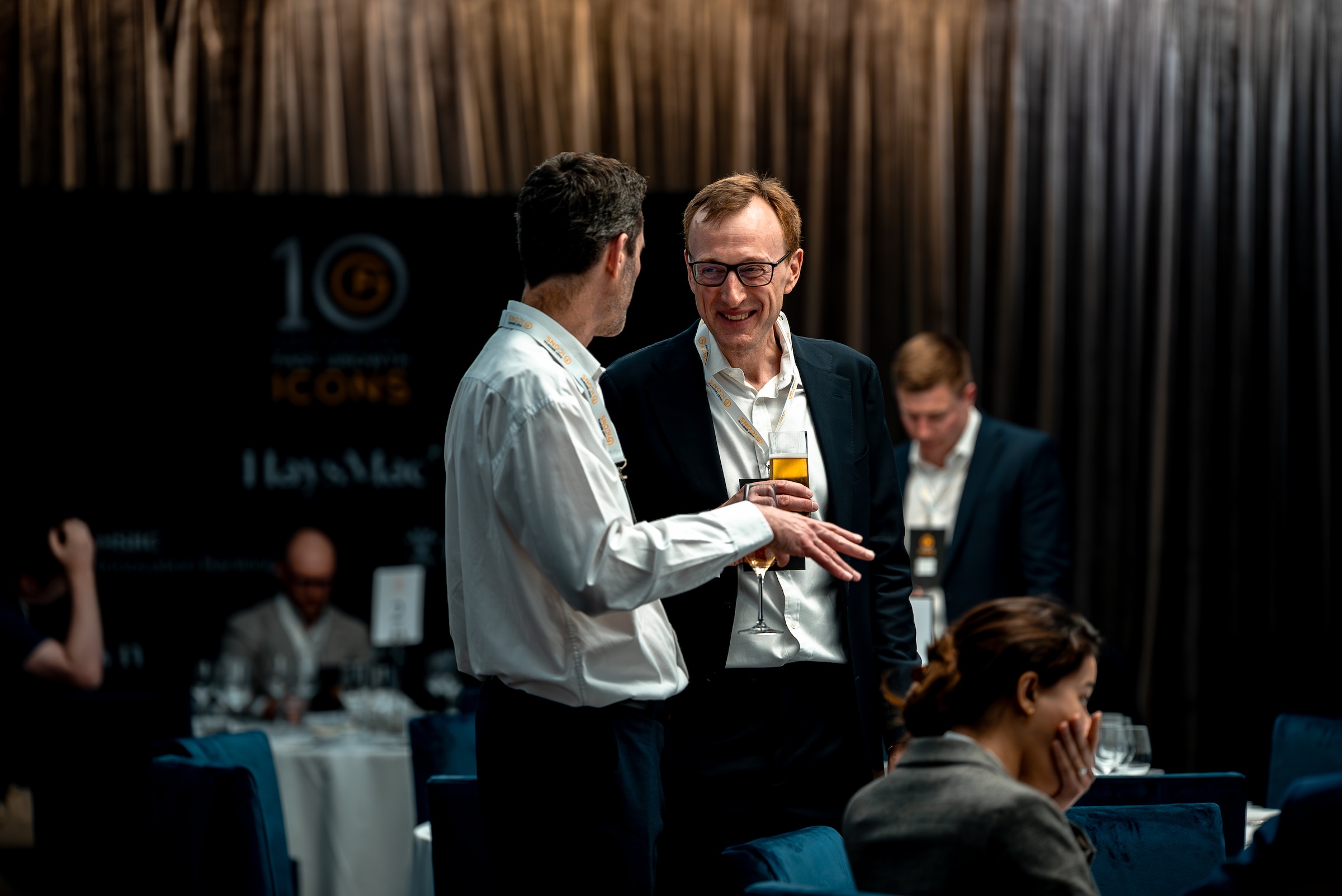 Candid networking conversation at the Fast Growth Icons 10th Anniversary event, photographed by We Stream
