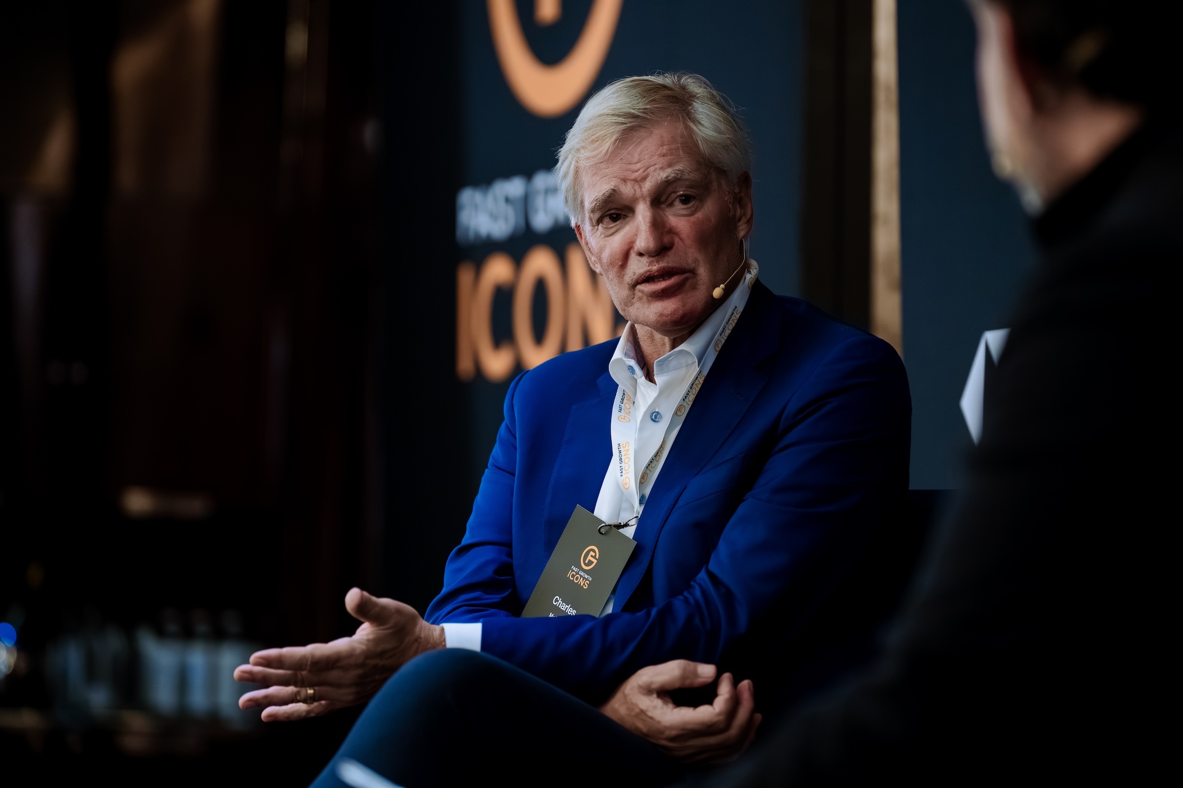 Panel discussion on stage at a Fast Growth Icons event, photographed by We Stream