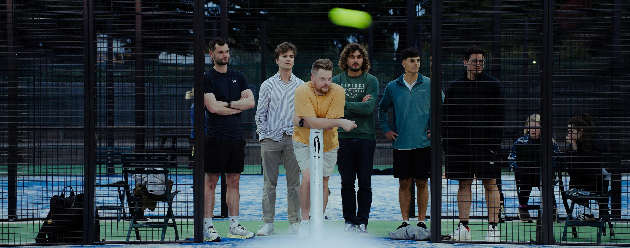 Team watching a padel match at the Maze company offsite event on the outskirts of London, photographed by We Stream
