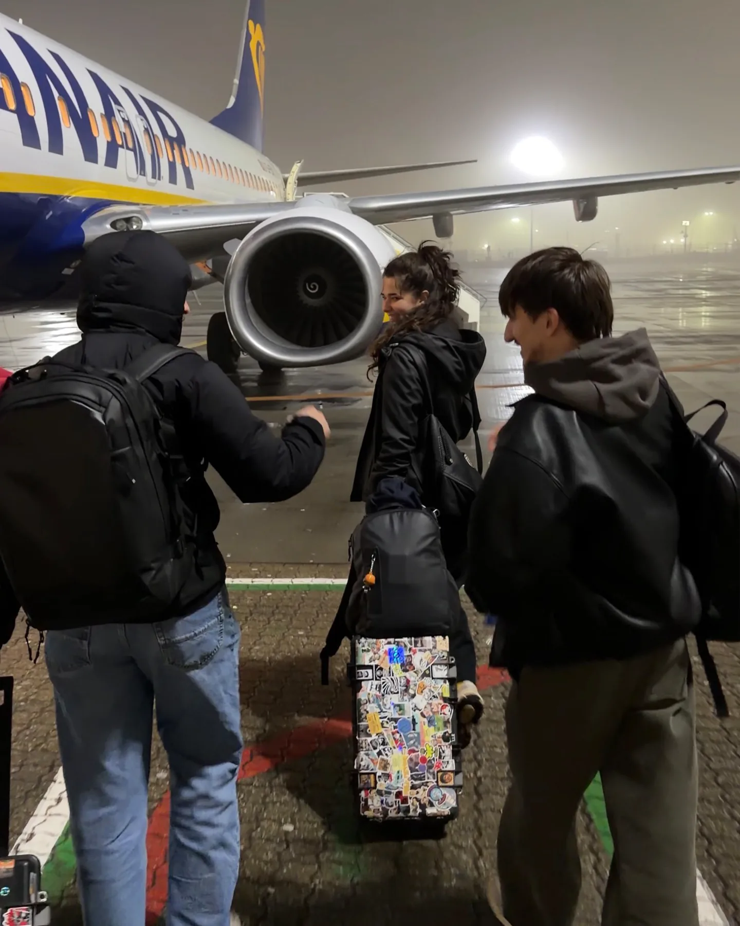 The crew with kit bags boarding a flight for an overseas shoot