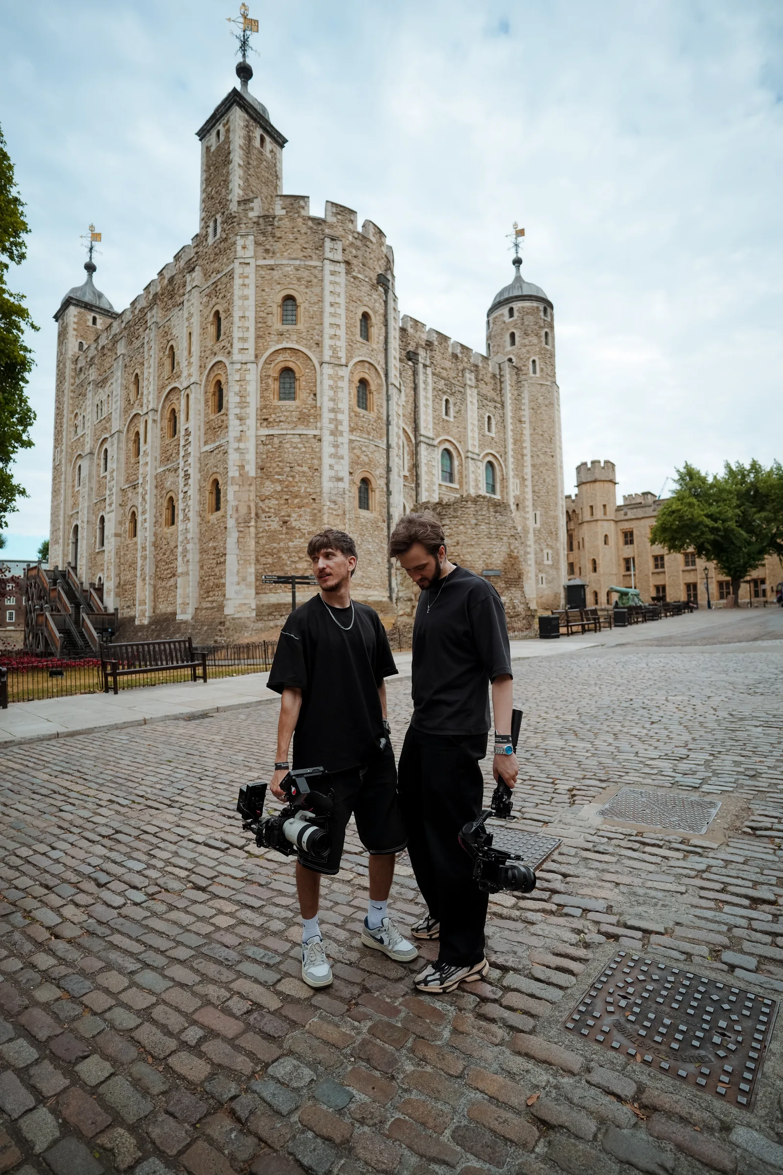 Two of the crew walking to a shoot at the Tower of London with kit
