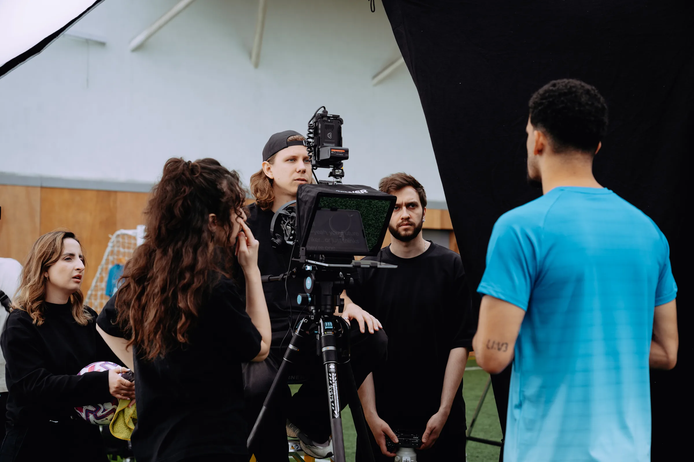 A full We Stream crew around the camera with talent on set
