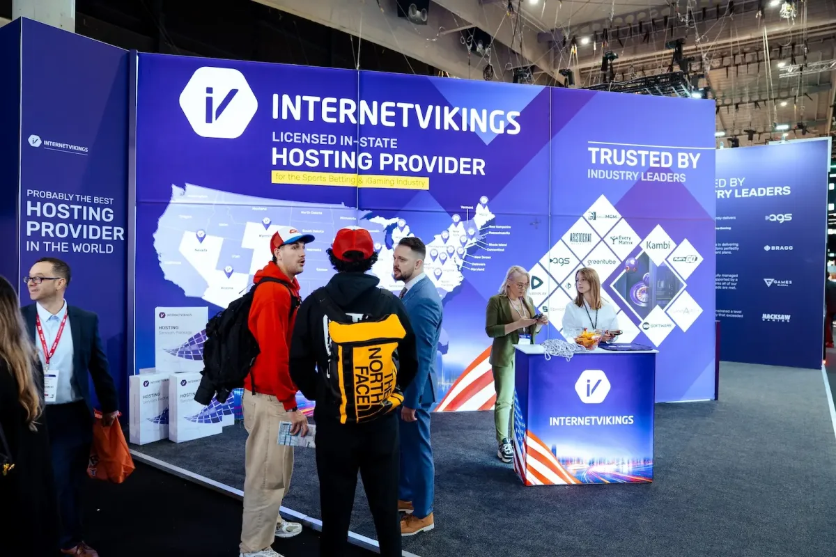 Visitors at the Internet Vikings stand with its US hosting map at ICE Barcelona 2026