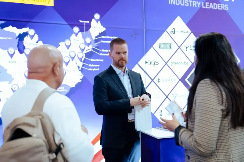 Internet Vikings team member talking with visitors on the stand at ICE Barcelona 2026