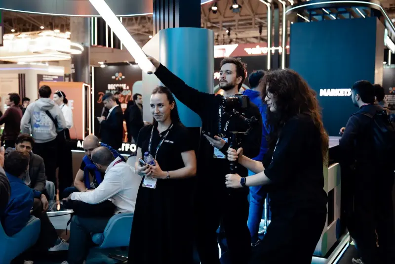 We Stream videographer with a gimbal filming on BitPace's stand at ICE Barcelona 2026