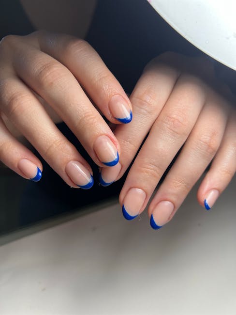 Professional french tip nails design with intricate patterns - Toronto nail salon