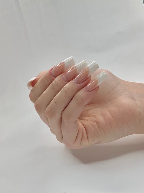 Professional french tip nails design with intricate patterns - Toronto nail salon