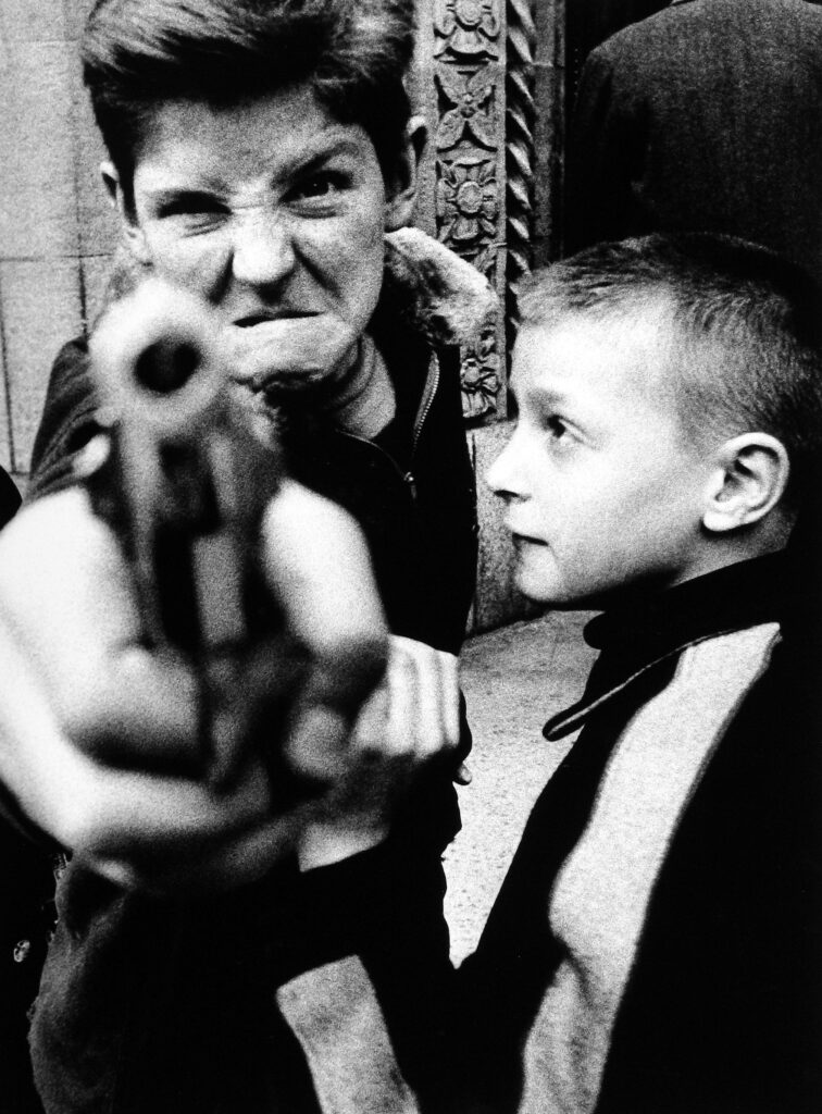 From gritty city street scenes to irreverent fashion spreads, William Klein’s photography runs the gamut and spans decades. Gun 1, New York, 1