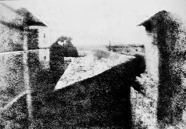 Nicéphore Niépce’s earliest surviving camera photograph, circa 1826: View from the Window at Le Gras (Saint-Loup-de-Varennes, France). Could be easily interpreted as a “street photograph” (via Wikipedia)