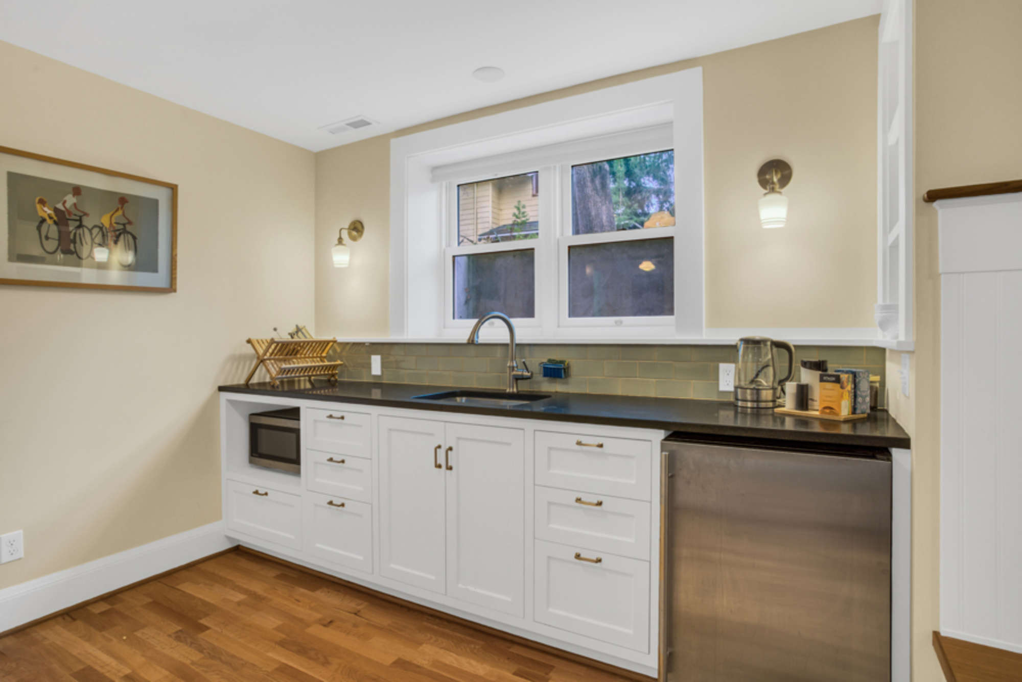 Kitchenette has a sink, french press coffee maker, microwave and mini fridge.