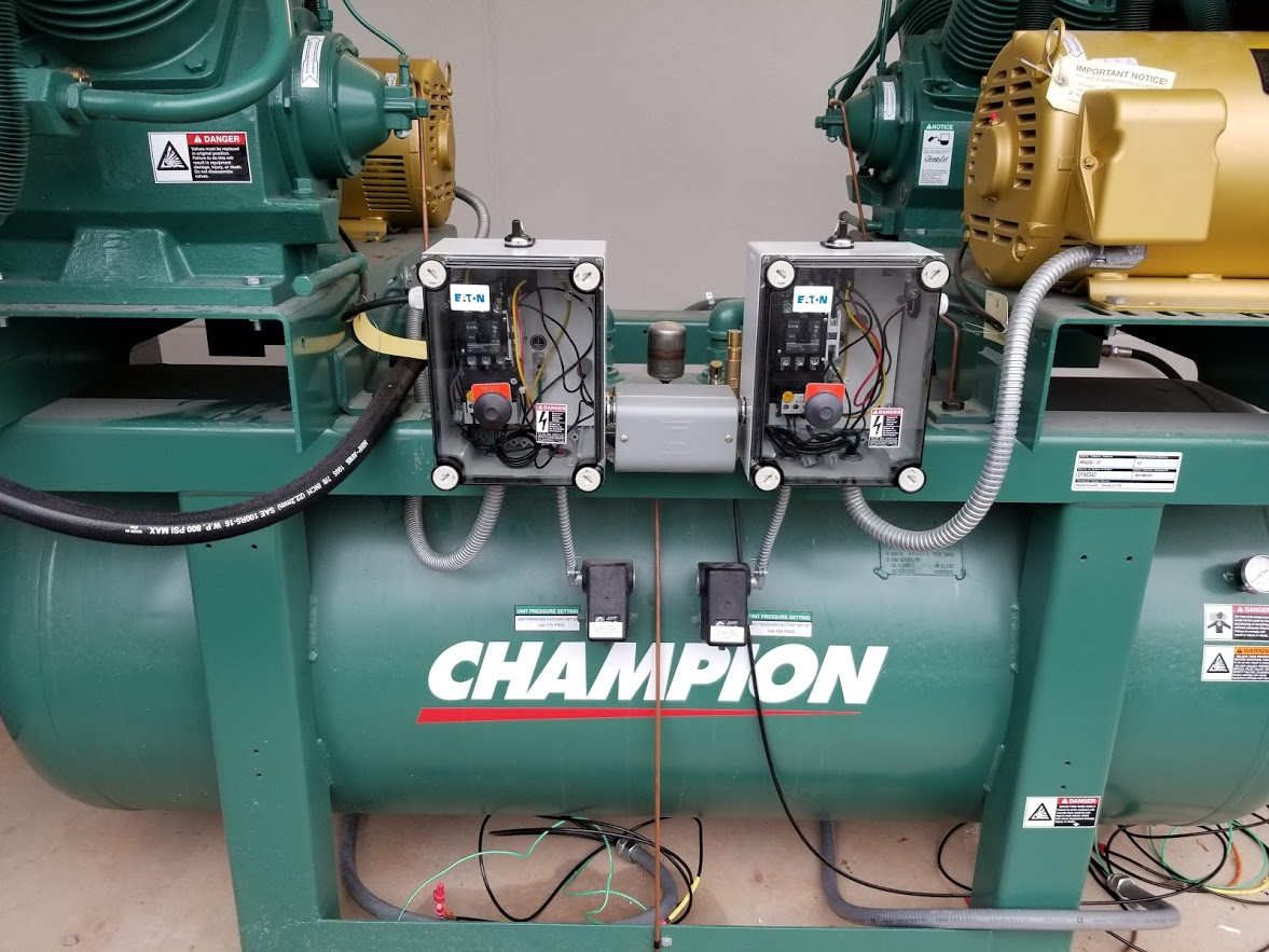 Air compressors, like this one from Champion, are a must in any shop.