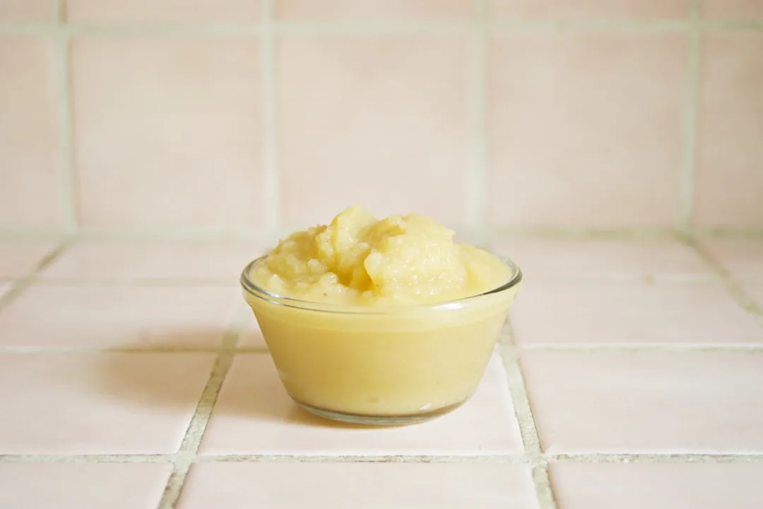 yellow cream in clear glass bowl