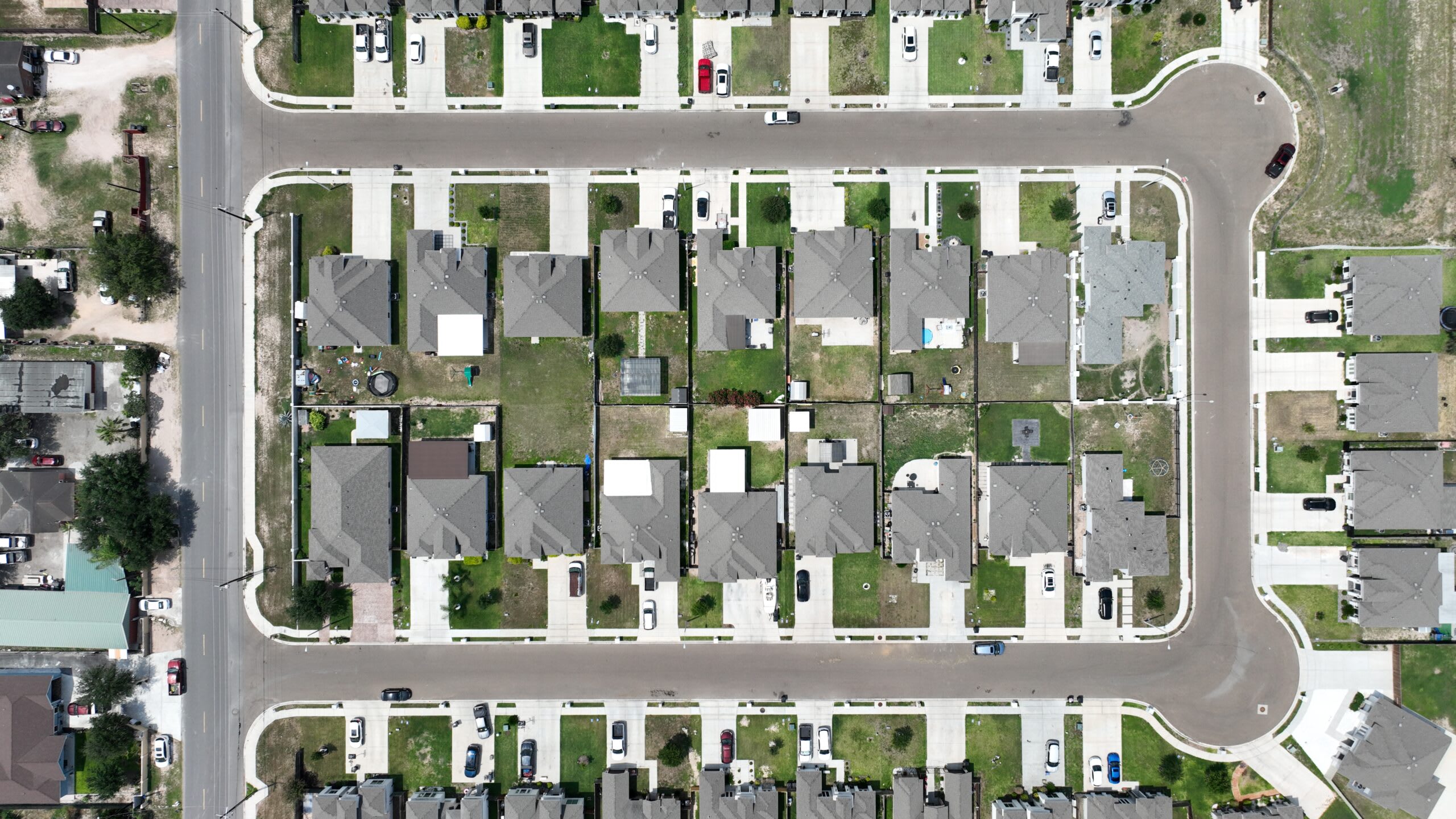 Aerial view of Comarex rooflines and lot layout