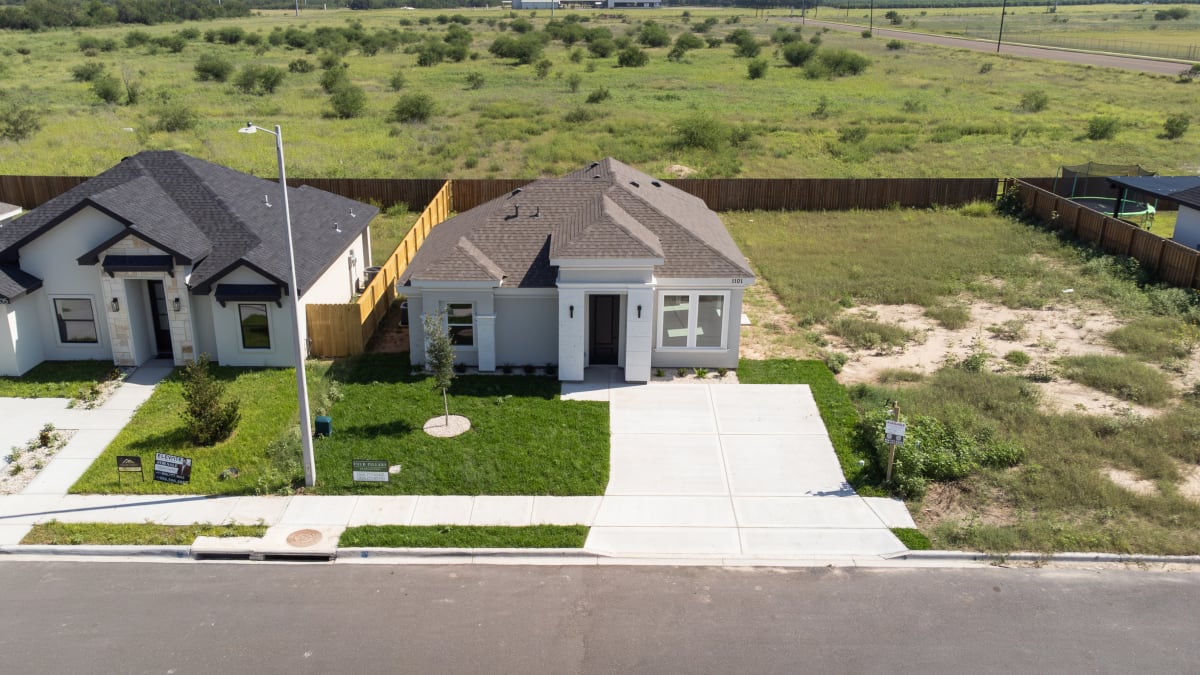 Aerial view of the completed single-storey home at 1101 Altuve Drive, showing the front elevation and driveway