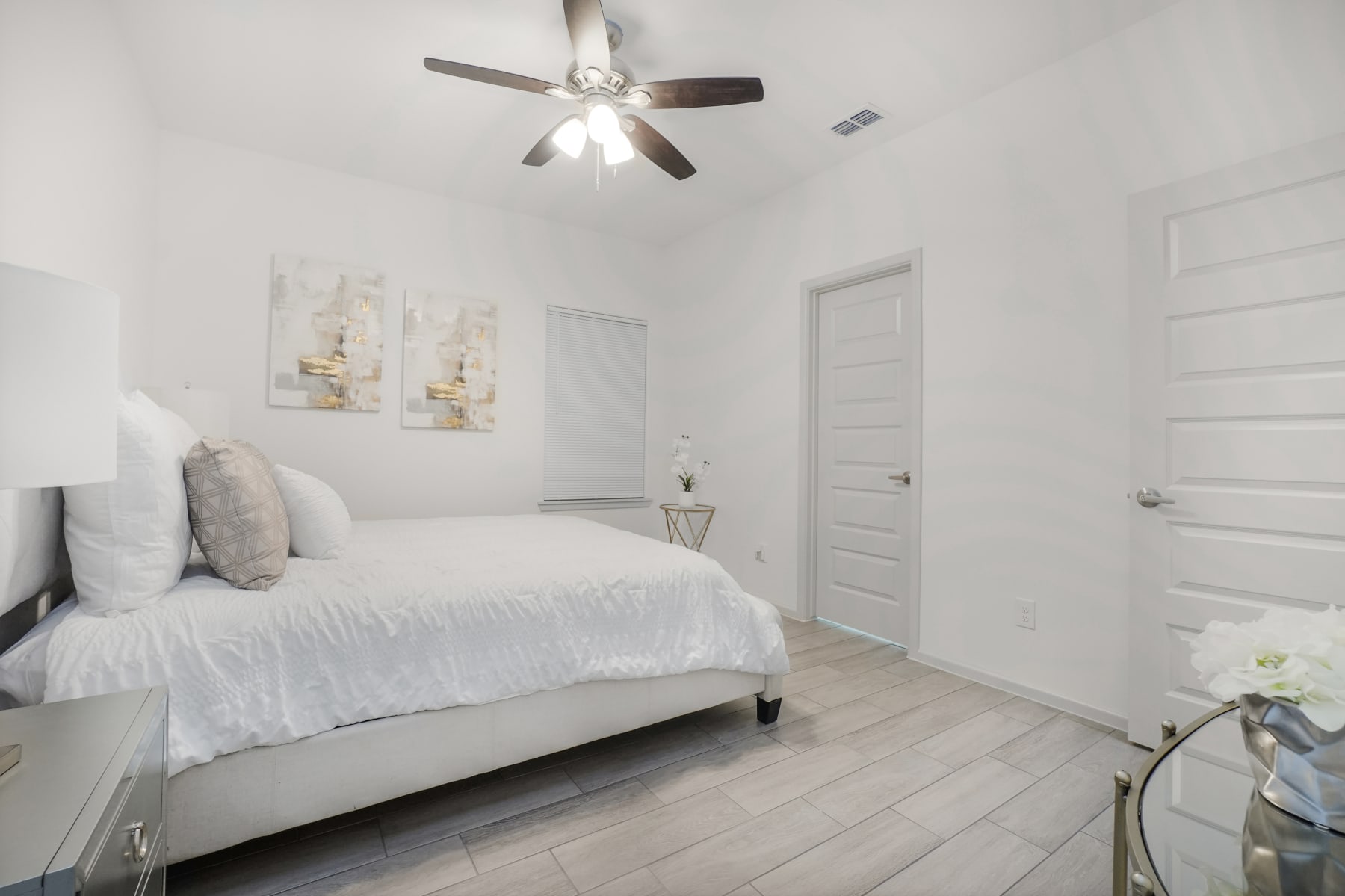 Sugar Mills bedroom alternate angle with bright neutral decor