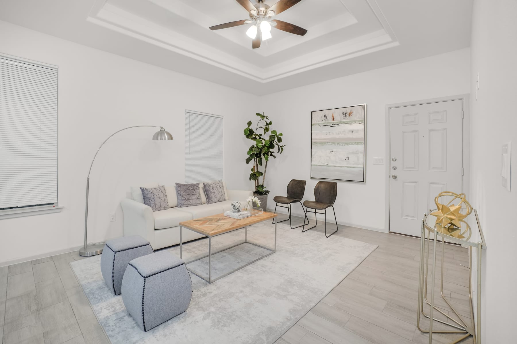 Sugar Mills lounge view with accent chairs and bright interior lighting