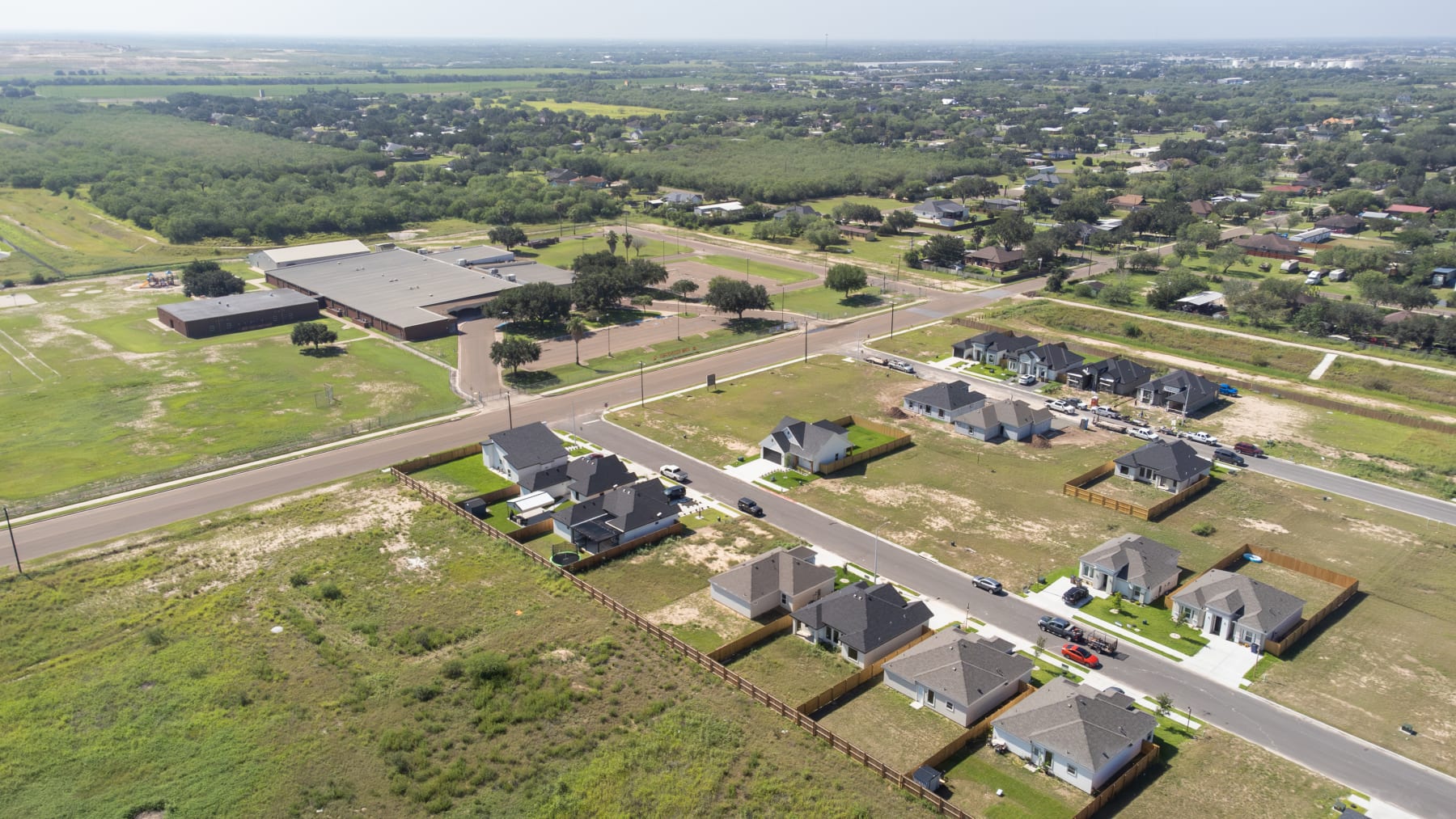 High aerial view of the Oso Grande subdivision within the surrounding Edinburg farmland