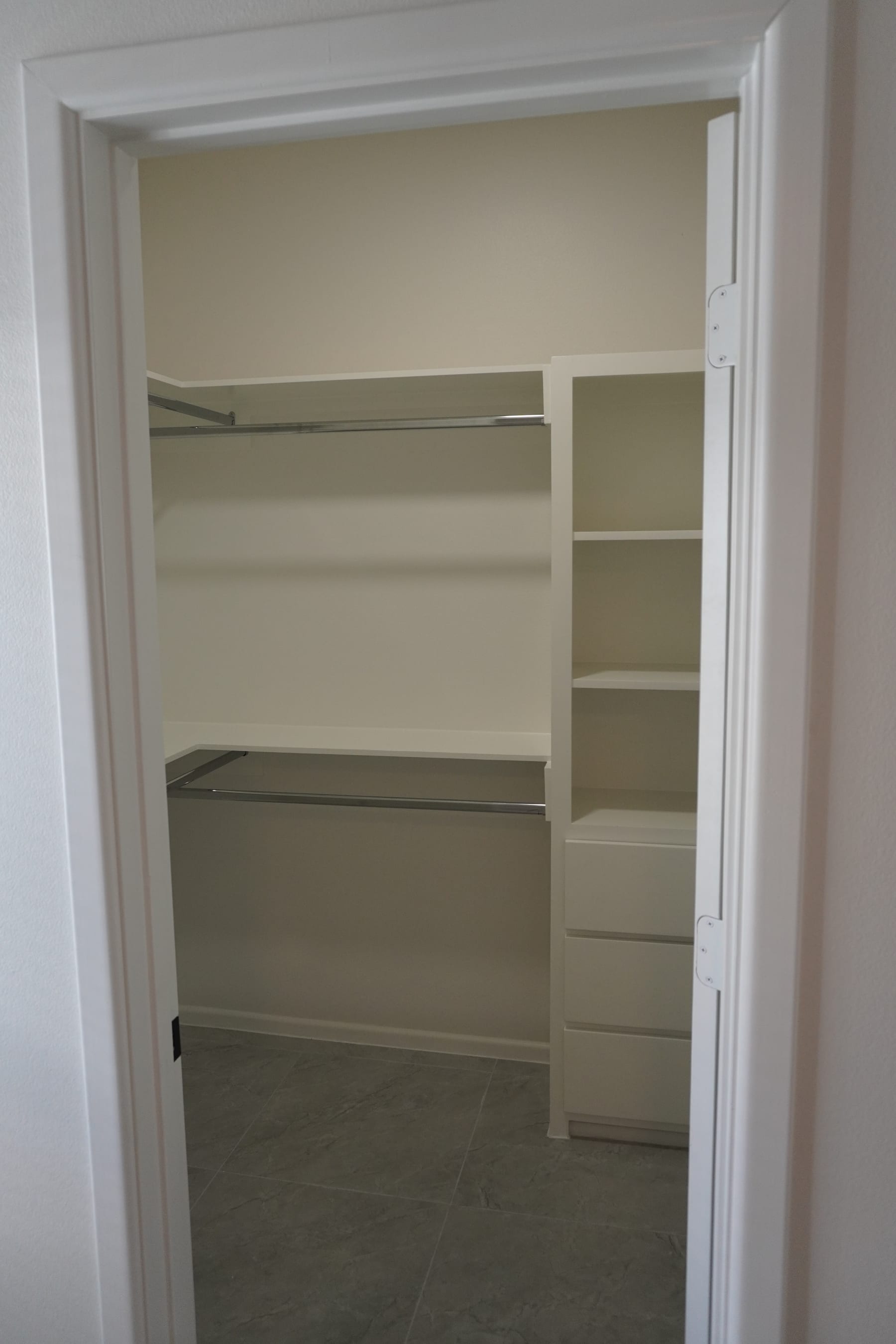 Custom walk-in closet with built-in shelving and organizers
