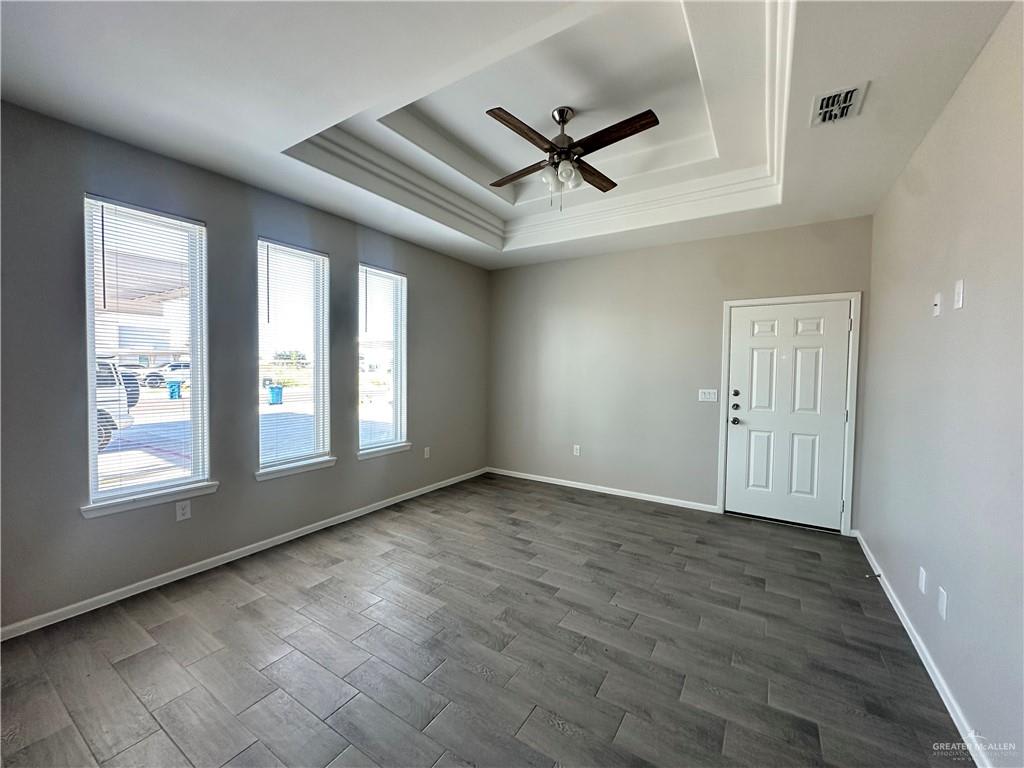 Riverside Tower living room looking toward the front door, with three windows onto the carport