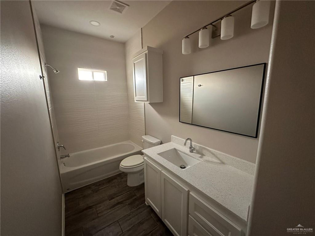 Heights at Alamo bathroom with a tub and shower combination and a white vanity