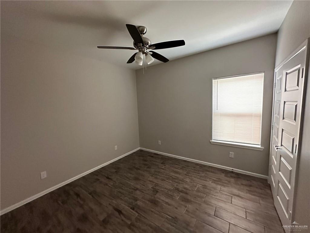 Heights at Alamo bedroom with a ceiling fan, a window and a paneled closet door