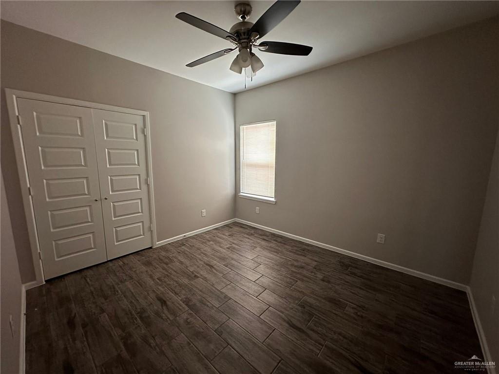 Heights at Alamo bedroom with double paneled closet doors and a ceiling fan