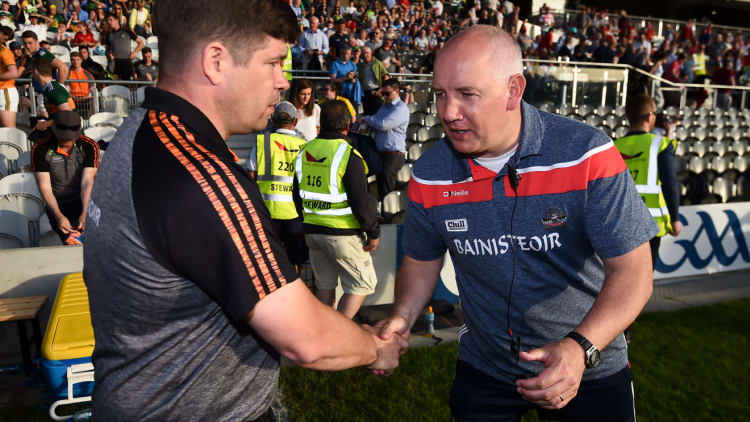 Kerry manager Eamonn Fitzmaurice, left, and Cork manager Ronan McCarthy following the Munster GAA Football Senior Championship Final match between Cork and Kerry at Páirc Ui Chaoimh in Cork.
