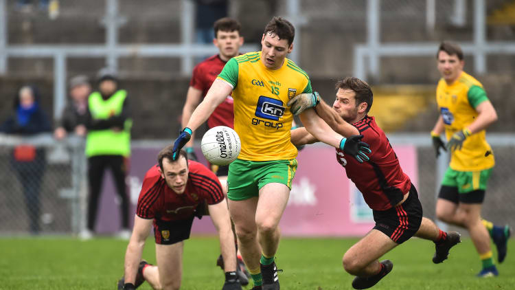 Jamie Brennan, Donegal, and Gerard Collins, Down, in Bank of Ireland McKenna Cup action at Pairc Esler, Newry.