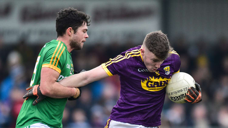 Niall Hughes, Wexford, and Ben Brennan, Meath, during the Bord Na Mona O'Byrne Cup clash in Enniscorthy.