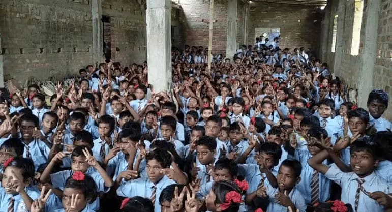 Hundreds of rural school children joining an Orphosys Foundation abacus learning session in India