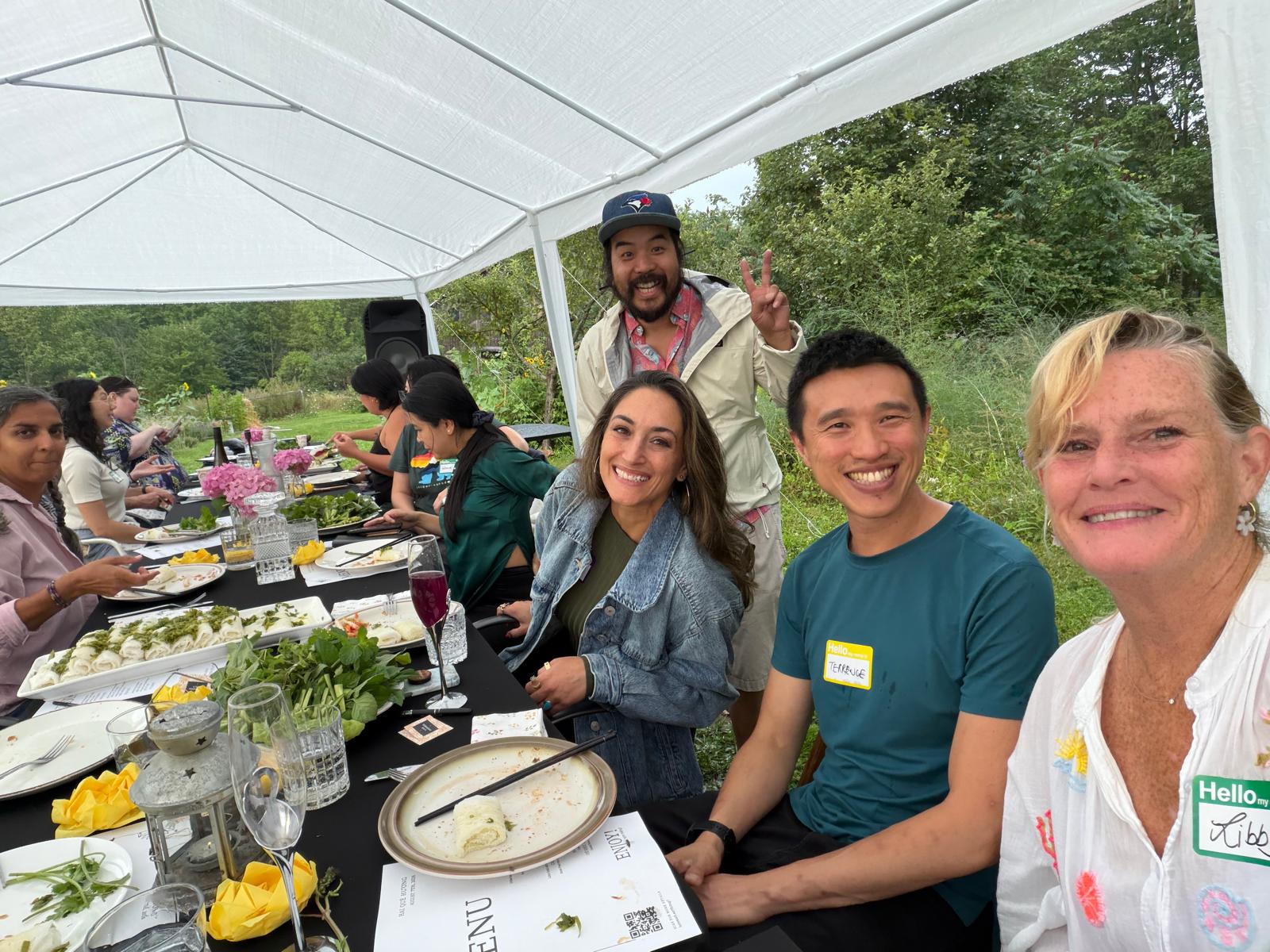 A group of guests smiling at the table
