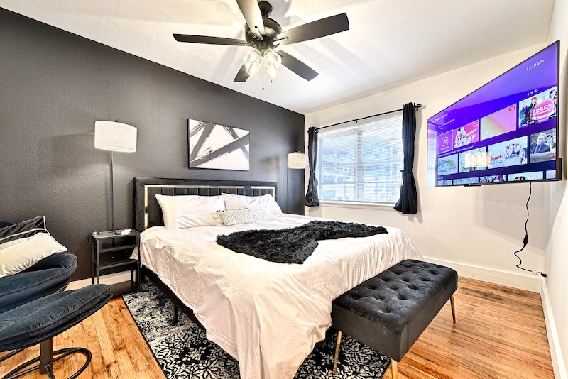 Modern furnished suite interior with king bed