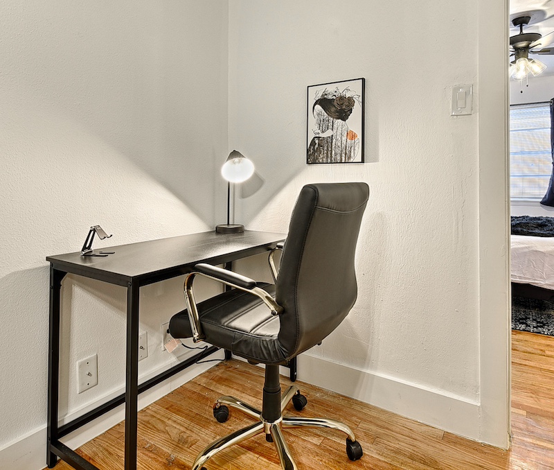 Modern furnished suite interior with king bed