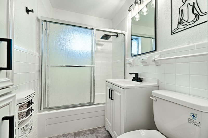 Modern bathroom with rain shower and LED mirror