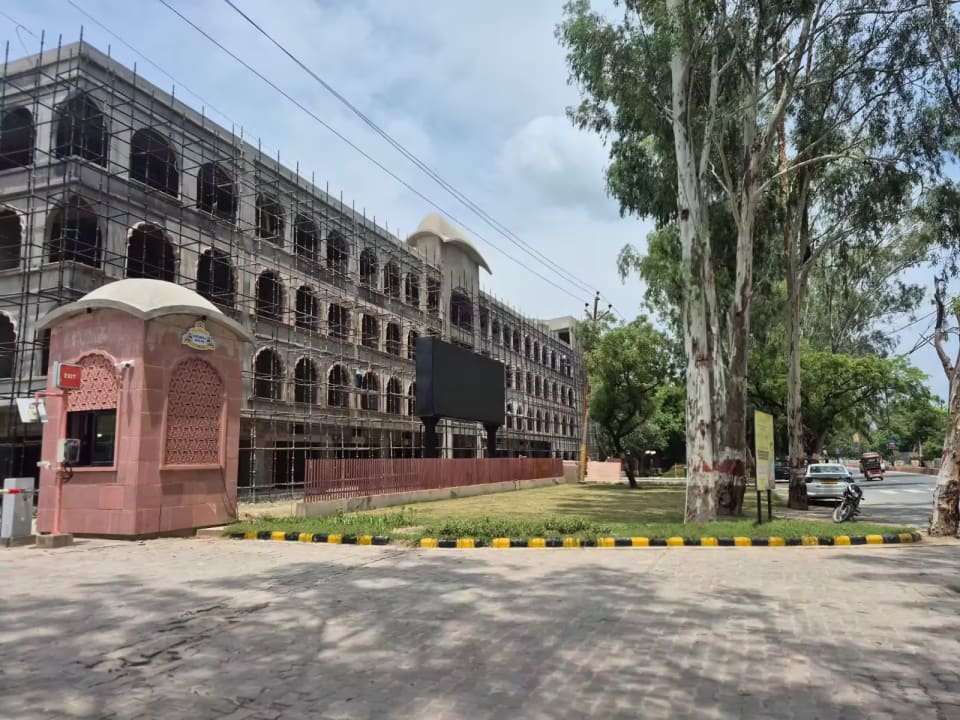 Corner façade and arched exterior of Krishna Bhumi Arcade under construction