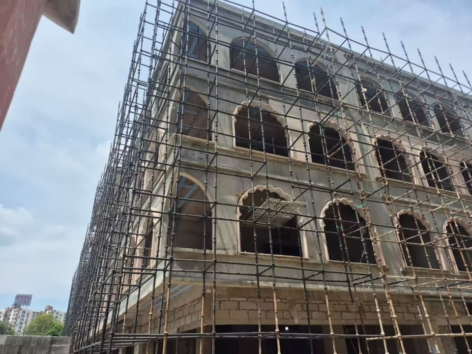 Close upward view of Krishna Bhumi Arcade exterior construction