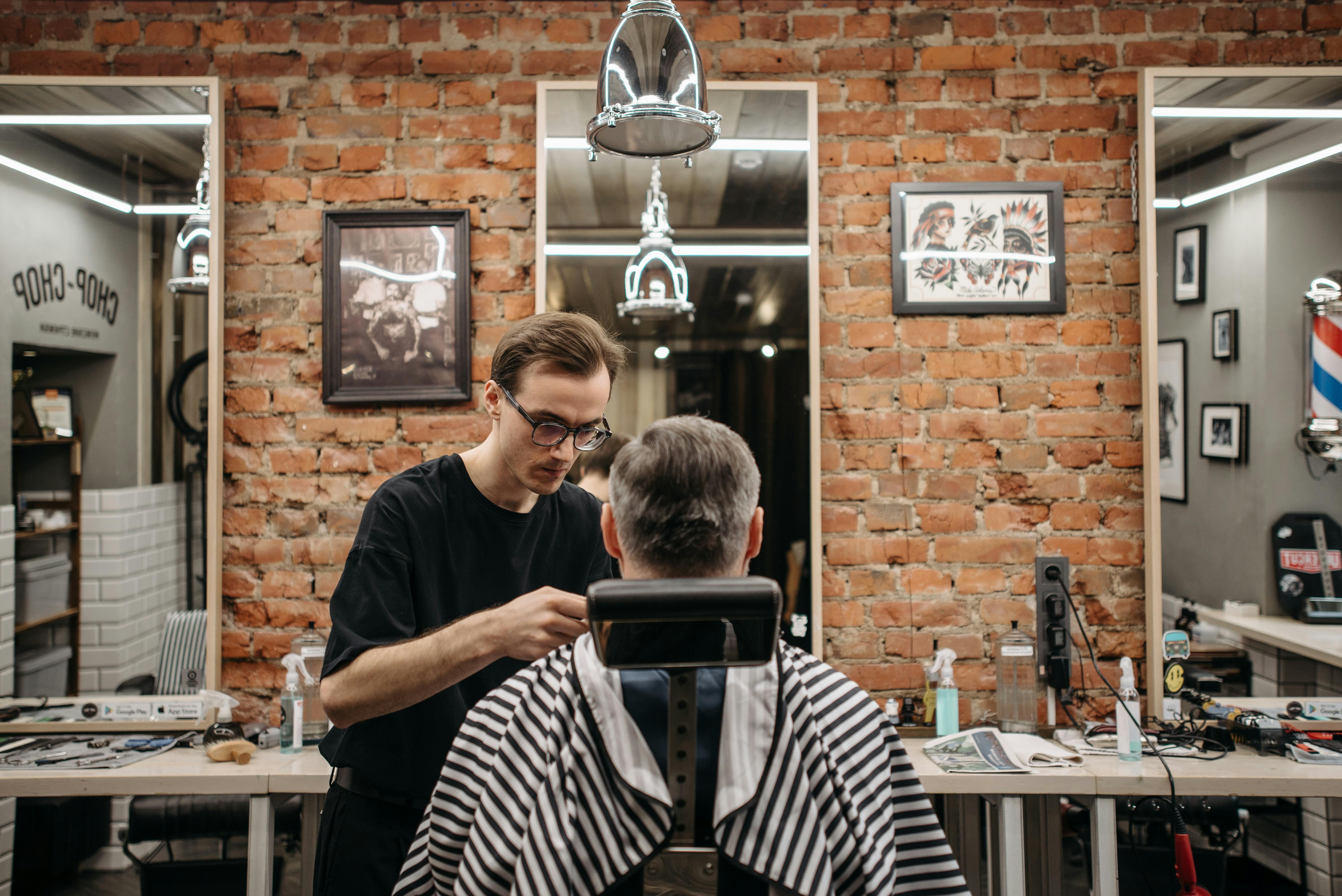 A Barber Coloring man's Hair in a Best Barbershop for Men’s Hair Colour in Kellyville