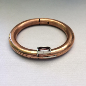 Oval copper bangle with oblong cabochon Garnet