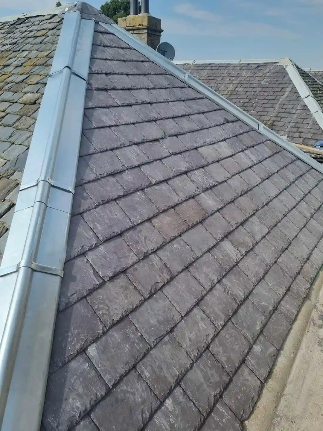 Freshly pointed ridge line on a completed Walker roof