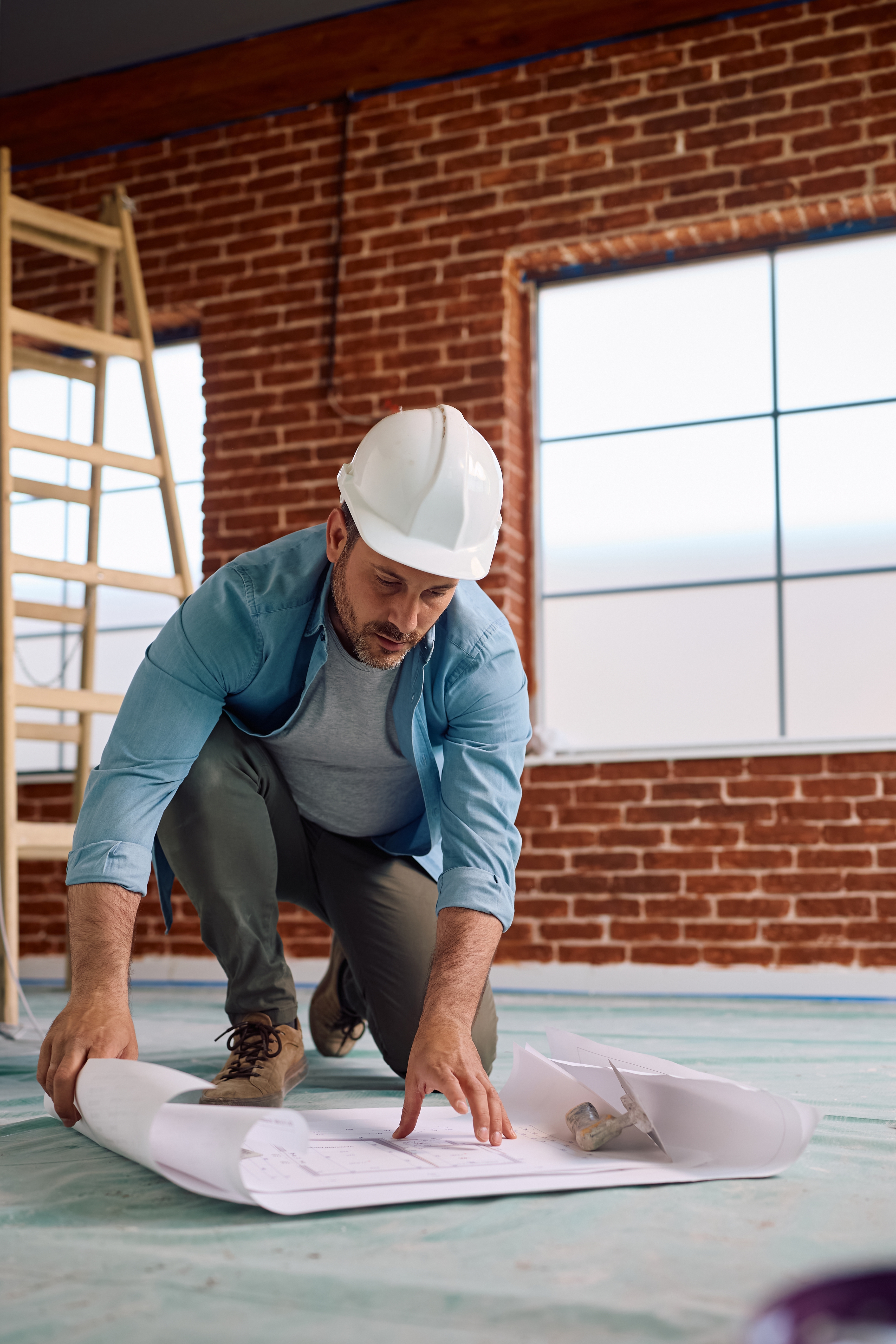 Licensed contractor reviewing surety bond paperwork, representing Greenwood General's contractors license bond program for brokers